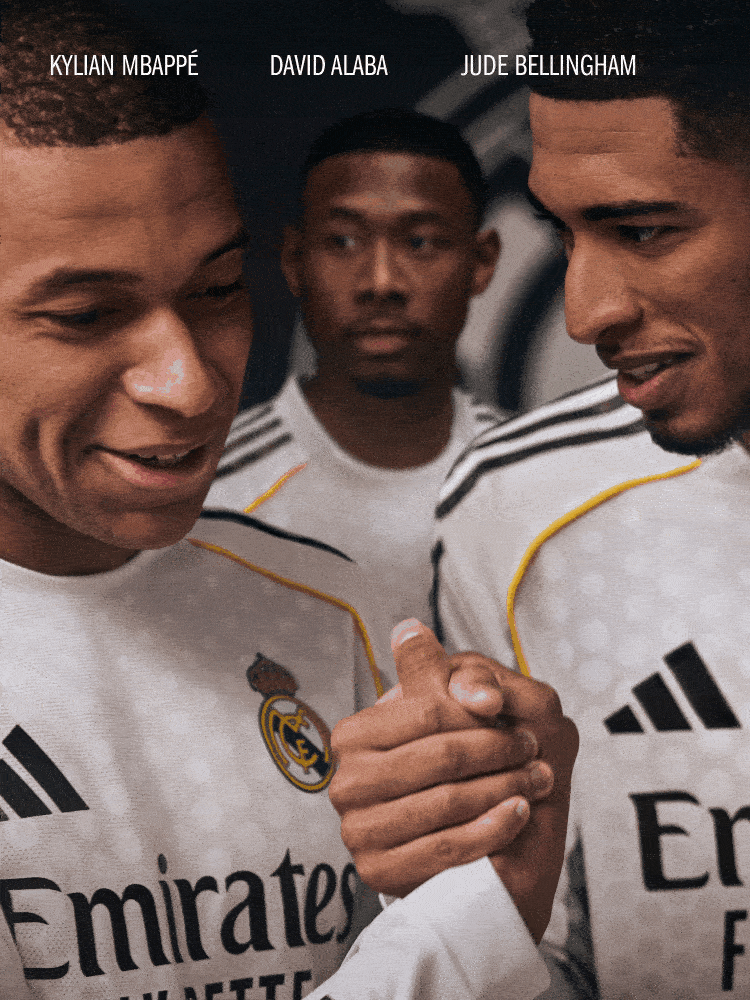 Three young men, dressed in sports uniforms, are standing together and shaking hands in what appears to be a sports or athletic setting.
