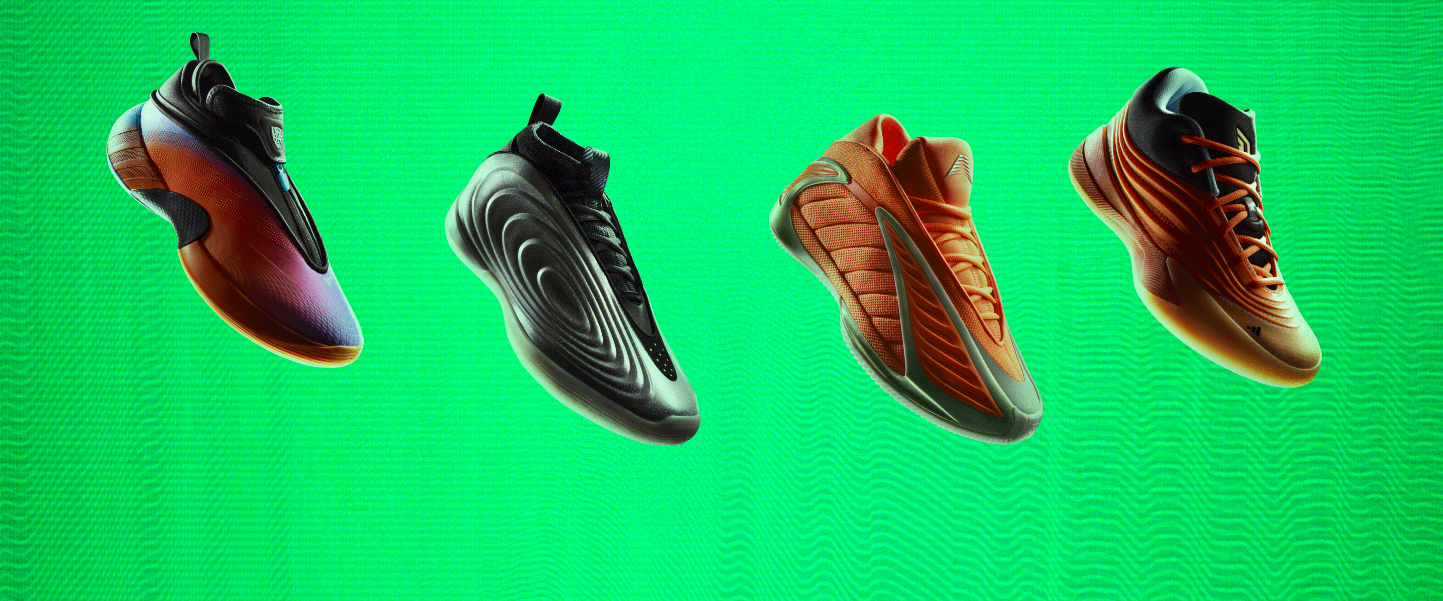 Four pairs of colorful, stylized soccer cleats against a vibrant green background.