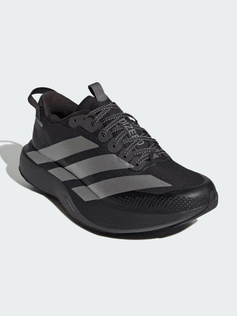 A pair of black and gray athletic shoes with a sleek, modern design sits on a plain background.