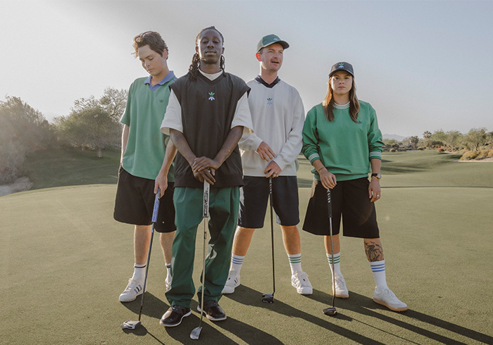 Group of adidas skateboarders stand on a golf course wearing the adidas Rolling Links Collection