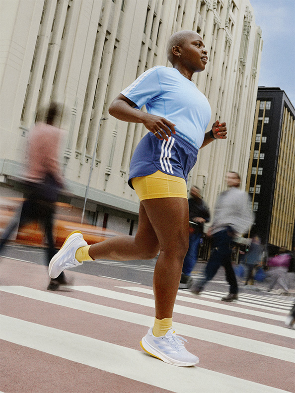 Image of a woman running outdoors wearing Supernovas.
