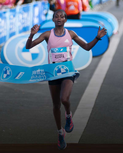 Image of a runner crossing the finish line.