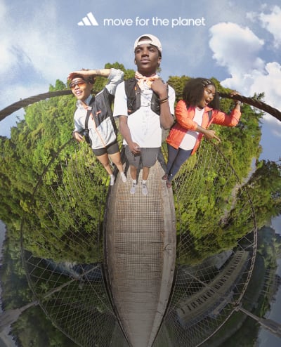 Visual of a tiny planet with hikers on a bridge in the nature