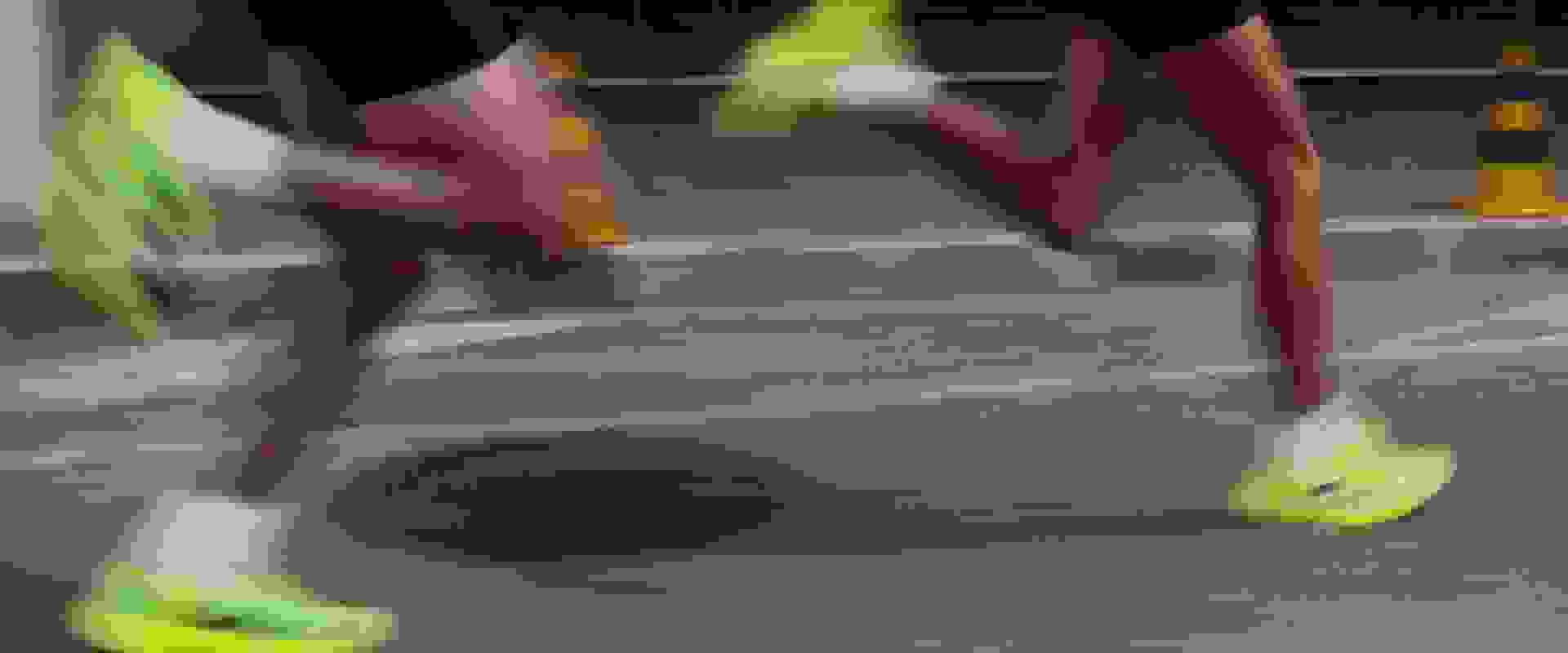 A blurred, ghostly figure emerges from a dark, mysterious background.