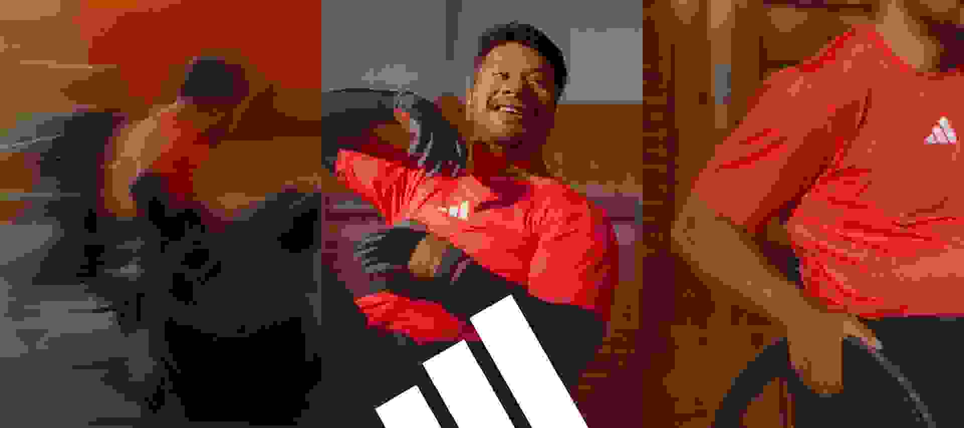 Blurred picture of wheelchair rugby athletes playing in the Adaptive wear collection. A portrait of a wheelchair rugby player wearing the red Adaptive t-shirt. Focus on the t-shirt and pant Adaptive wear collection.