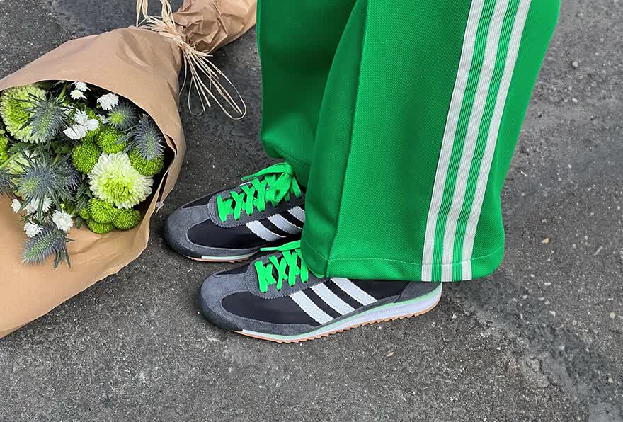 GIF of imagery with models holding flowers in the adidas Originals SL 72 shoes.