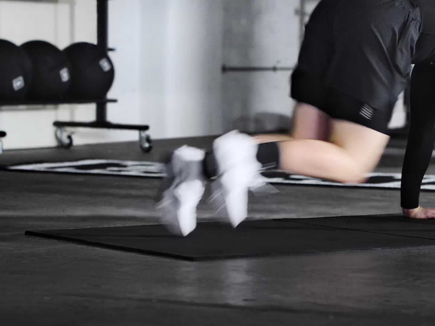 A close-up view of a person's hands wearing a white glove and a black sleeve, suggesting a professional or industrial setting.