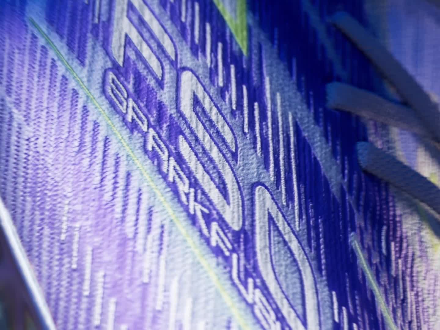 A 360 degree video of the new purple F50 Sparfusions soccer boot, set against a vibrant, colorful background with a sense of movement and depth.