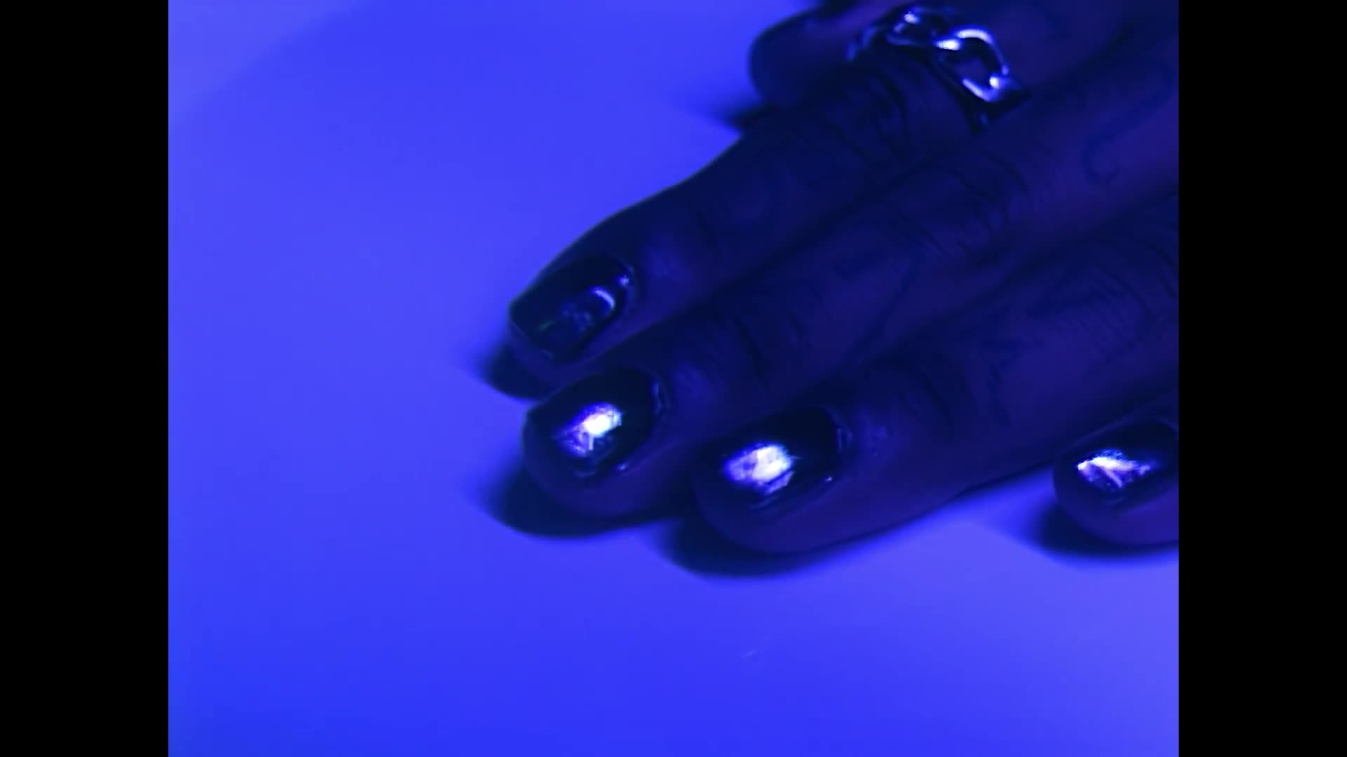 Video of basketball players conversing in dark room.