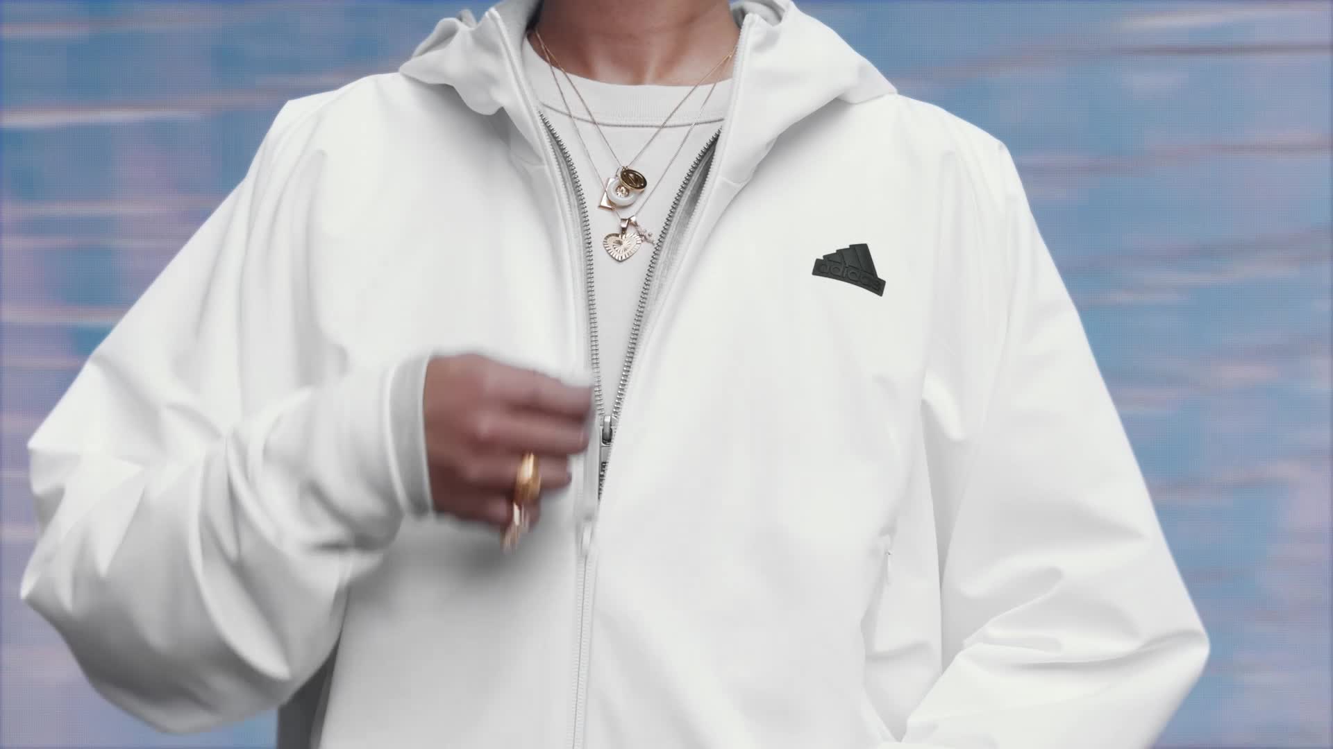 A video of a woman and a man wearing hoodies and pants from the adidas Z.N.E. collection in a studio setting. 