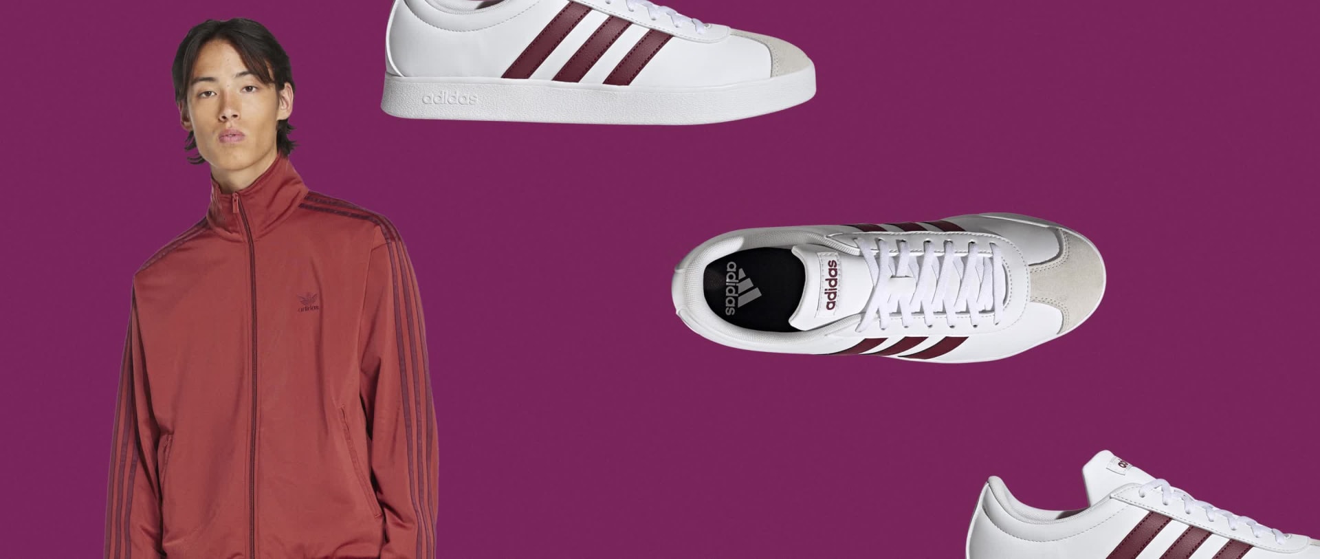 Une personne portant une veste de couleur rouille se tient sur un fond rose vif, avec deux sneakers blanches et bordeaux bien en vue au premier plan.