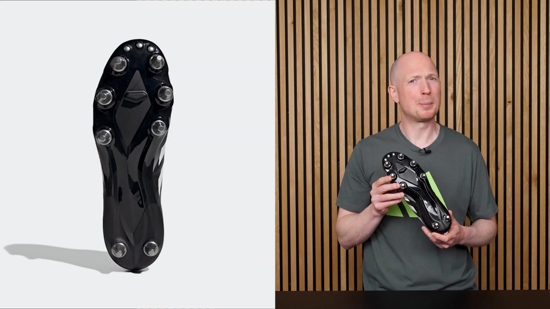 A person wearing a gray shirt stands in front of a wooden panel backdrop with the Adidas logo visible.