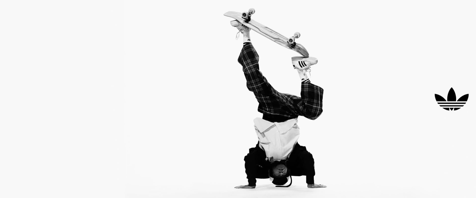 Black and white GIF of four people posing in adidas Superstar shoes and apparel. Mark Gonzales balances upside down with a skateboard, GloRilla crouches, Gabbriette stands with one leg raised in a long coat, and the fourth jumps mid-air.
