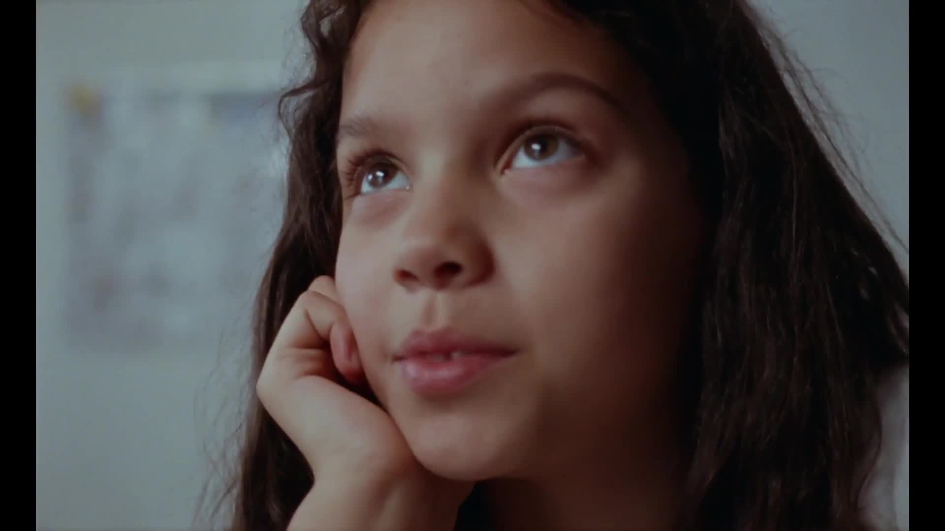 Girls in ballet dresses dance on apartment stairs, while two girls in adidas x Taqwa Bint Ali sneakers discuss their dreams and future.