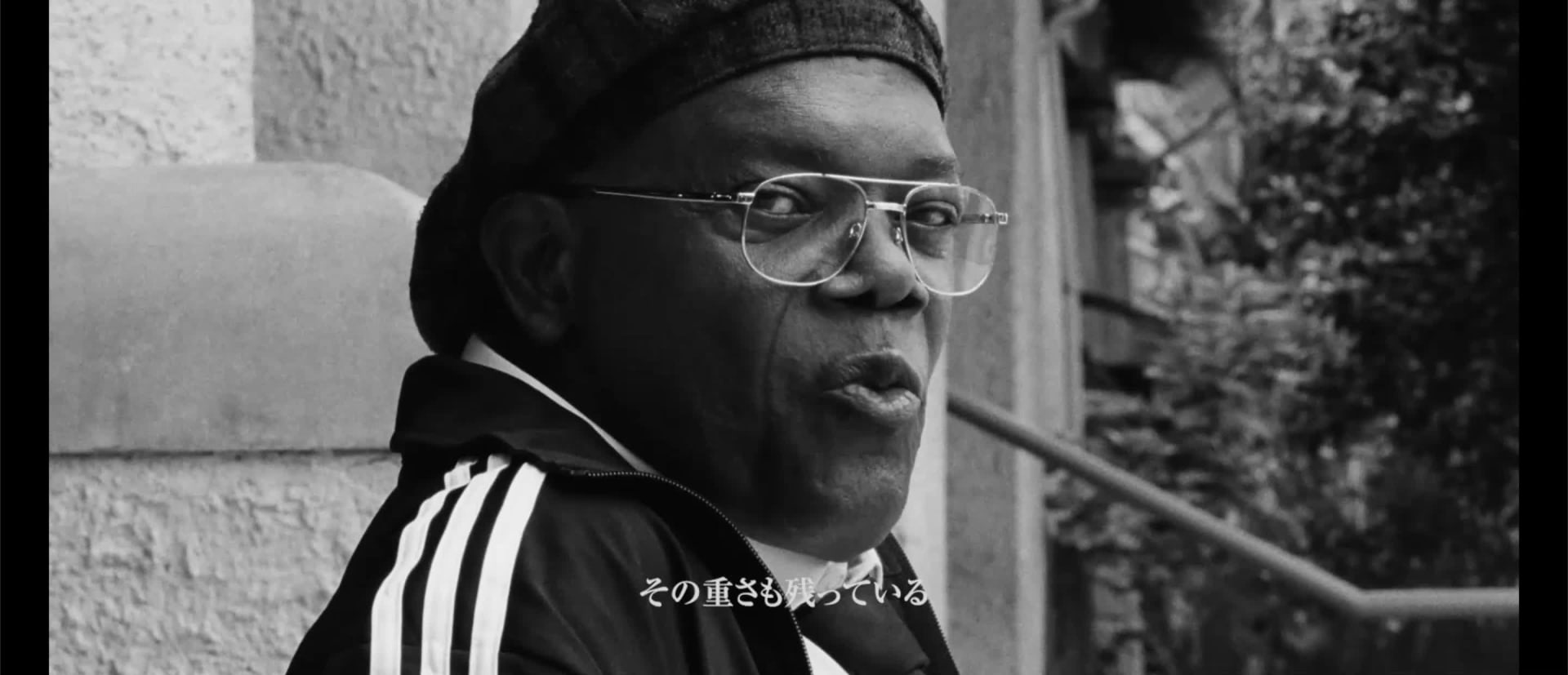 The image shows a dark, shadowy figure on a stage or platform, with a glowing light illuminating the figure from below, and the text "LEGEND ABOUT" displayed in the background.