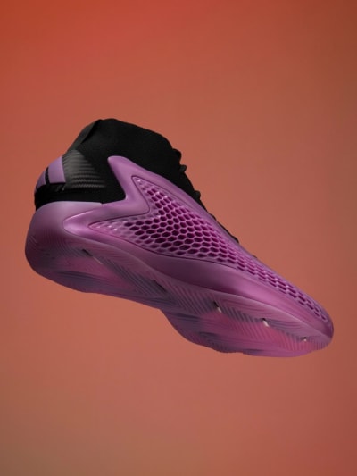 Anthony Edwards dunks a basketball in orange space